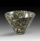 Rare vessel of porphyre with flat base and steep, downwardly tapering wall, ø 5.5cm at bottom, ø 15cm at the top, H 10cm. Rare shape! Early Dynastic P...