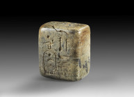 Stone weight with hieroglyphs, 2.5 x 3 x 1.8cm, 40.98g. The son of Re is mentioned in the text. Old Kingdom, 4th dynasty, ca. 2650 - 2500 BC. One part...
