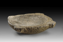 Black diorite mortar with four handles. Late Period, ca. 660 - 330 BC. ø 32cm, H 6cm. Edges bumped. Mörser. Spätzeit, ca. 660 - 330 v. Chr. ø 32cm, H ...