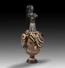 Apulian red-figure kantharos from the workshop of the Baltimore Painter. 330 - 320 BC. H 21cm, W with handles 20cm. On one side, a young woman sits on...