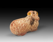 Figural Corinthian Aryballos in the shape of a ram with gold applications. Middle Corinthian, 590 - 570 BC. H 5.1cm, L 7.1cm. Cosmetic vessel designed...