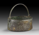 Bronze cista with engraved bathing scenes. Etruscan, 4th century BC. H 13.5cm, ø 28.5cm. With remnants of silver cover. Round vessel with flat base an...