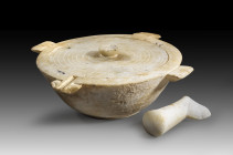Large marble mortar with lid and pestle. Early Cycladic to early Minoan, 2700 - 2200 BC. H with lid 11.4cm, W with handles 32.1cm, ø 26.3cm, ø lid 21....