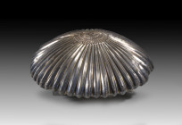 Achaemenid silver bowl in form of a rosette. 5th - 4th century BC. 170.7g. H 5.1cm, ø 16.5cm. Conical bowl made ot thin embossed silver in form of a c...