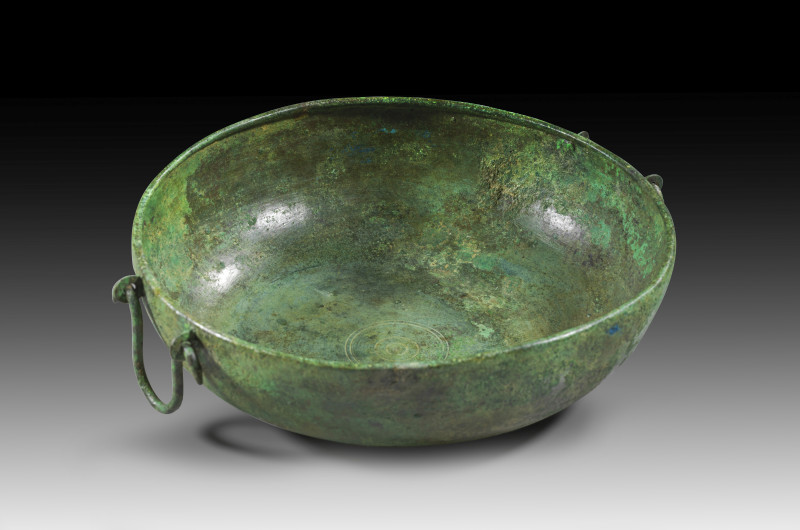 Bronze bowl with a flat bottom and curved walls with an inward-sloping lip. Conc...