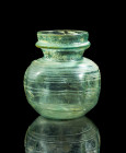 Beautiful balsamarium. H 12cm. Roman, 4th - 5th century AD. Turquoise clear glass. Rounded body with elaborate thread decoration and evenly moulded si...