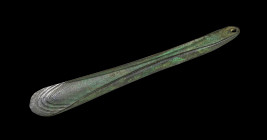 A bronze aged axe with ridges along the sides and wavy decor at the blade. Central Europe, proabaly eastern alpine, about 1st half 2nd millennium BC. ...