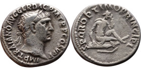 Trajan (98-117) Denarius. Obv: Laureate, draped bust of emperor. Rev: Dacian wearing peaked cap, seated on shield in mourning, curved sword below.

...