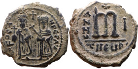 Phocas and Leontia.(602-610) Follis. Obverse: Standing Phocas and Leonita Reverse: Large m between ANNO and regnal year.

28mm 11,45g