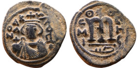 al-Malik ibn Marwan (687-705), Byzantine style folis Obverse: Imperial figure holding globe and cross Reverse: M and inscription

22mm 4,74g