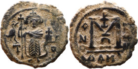 al-Malik ibn Marwan (687-705), Byzantine style folis Obverse: Imperial figure holding globe and cross Reverse: M and inscription

19mm 2,99g