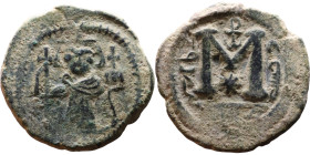 al-Malik ibn Marwan (687-705), Byzantine style folis Obverse: Imperial figure holding globe and cross Reverse: M and inscription

22mm 4,72g