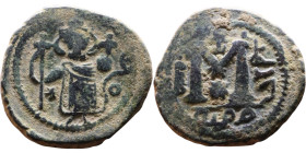 al-Malik ibn Marwan (687-705), Byzantine style folis Obverse: Imperial figure holding globe and cross Reverse: M and inscription

22mm 5,70g