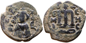 al-Malik ibn Marwan (687-705), Byzantine style folis Obverse: Imperial figure holding globe and cross Reverse: M and inscription

22mm 3,98g