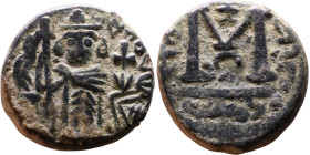 al-Malik ibn Marwan (687-705), Byzantine style folis Obverse: Imperial figure holding globe and cross Reverse: M and inscription

17mm 4,66g