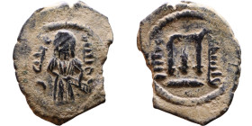 al-Malik ibn Marwan (687-705), Byzantine style folis Obverse: Imperial figure holding globe and cross Reverse: M and inscription

17mm 2,23g