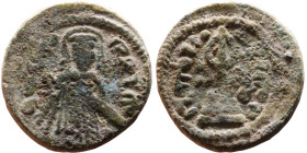 al-Malik ibn Marwan (687-705) Follis. Obverse: Standing caliph Reverse: Modified cross potent set on steps

17mm 2,56g