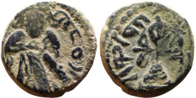al-Malik ibn Marwan (687-705) Follis. Obverse: Standing caliph Reverse: Modified cross potent set on steps

15mm 3,46g