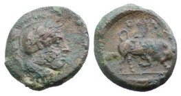 LUCANIA - THURIUM (IV Sec. a.C.) BRONZO gr.3,2 - D/Testa elmata di Atena a d. R/Toro cozzante a s. con sopra scritta - AE - Sng.Ans. 1194 BB