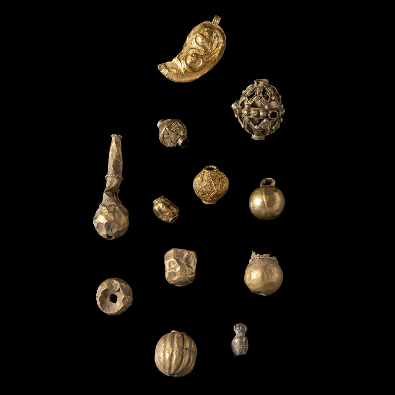 A group of 12 Eastern Greek and Western Asian gold necklaces elements. 2nd-1st M...