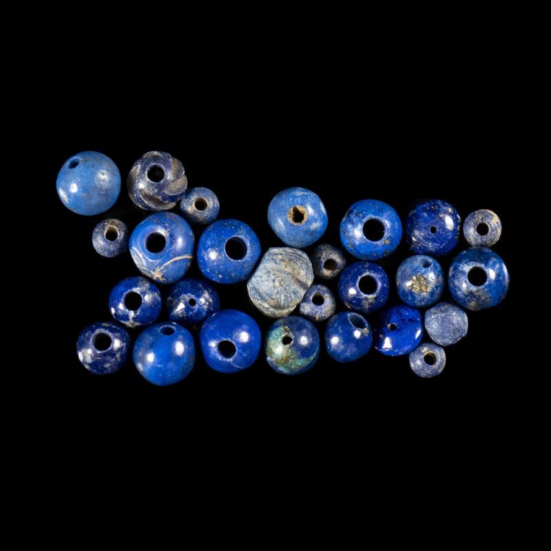 A GROUP OF RARE 26 EGYPTIAN LAPIS LAZULI, BLUE GLASS AND SODALITE BEADS.
New-Ki...