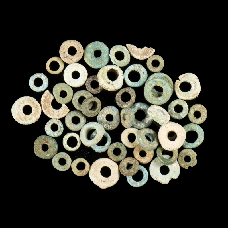 A GROUP OF 35 EGYPTIAN FAIENCE BEADS.
New-Kingdom,ca. 1550-1069 BCE
Diam. Min ...
