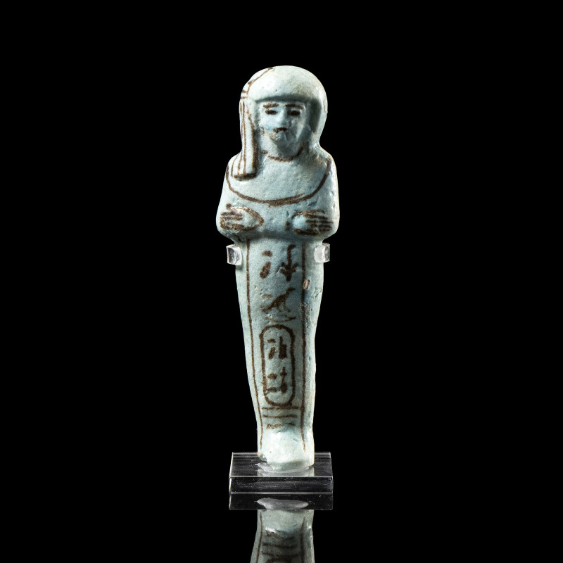 AN EGYPTIAN TURQUOISE FAIENCE SHABTI OF QUEEN ISET-NOFRET. New-Kingdom, Reign of...