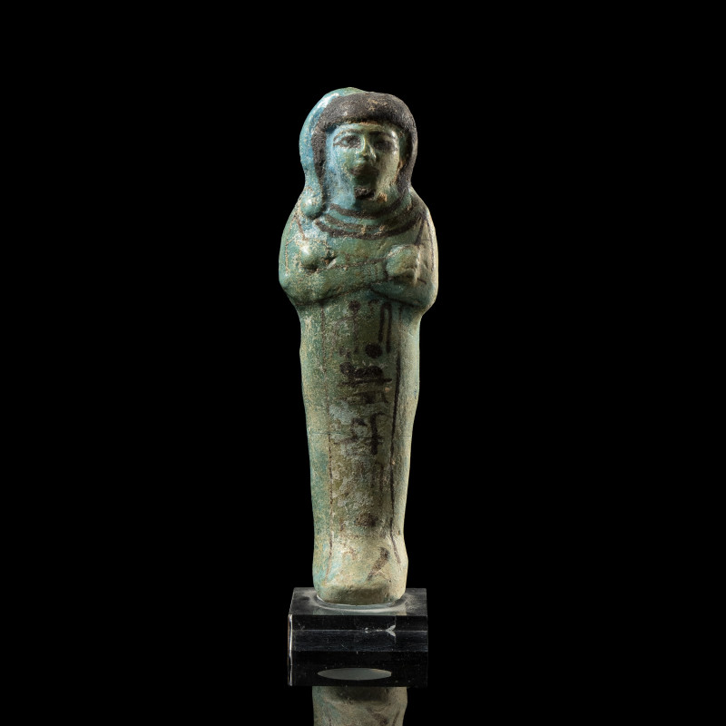 AN EGYPTIAN BLUE FAIENCE GLAZED SHABTI OF PRINCE KHAEMWASET.
New-Kingdom, Reign...