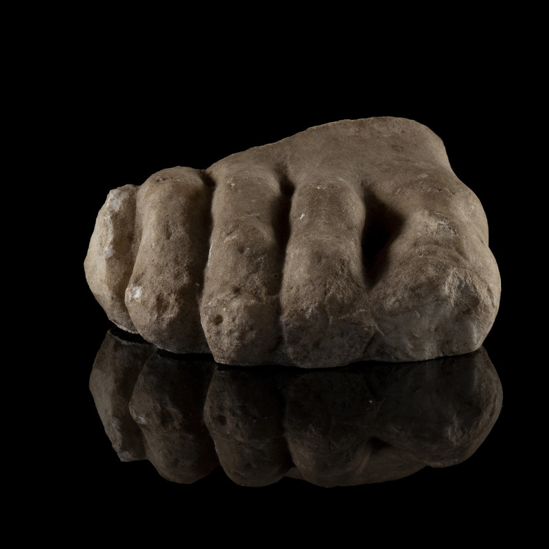 A ROMAN MARBLE FRAGMENT OF A FOOT.
1st-3rd century A.D.
L. 10,5 cm

Estimate...