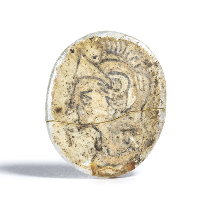 *A RARE ROMAN GLASS WITH PAINTED DESIGN. HEAD OF ATHENA.
1st-3rd century A.D.
...