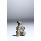 A LATE NEOLITHIC MARBLE SEATED FIGURE.
Ca. 5300-4500 BCE
H. 2,4 cm

Provenance
Swiss private collection of the Numismat Giovanni Maria Staffieri,...