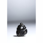 A NEOLITHIC BLACK STONE IDOL PENDANT.
Ca. 4000-3500 BCE
Dim. 21,6 x 18 mm

Provenance
Swiss private collection of the Numismat Giovanni Maria Sta...