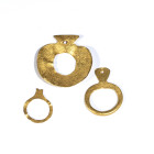 A GROUP OF EUROPEAN CHALCOLITHIC GOLD PENDANTS.
Varna, circa 4550-4450 BCE
Dim. Max. 30,8 x 33,09 mm / min. 20,20 x 16,13 mm

Provenance
Swiss pr...