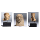 A GROUP OF GREEK TERRACOTTA FEMALE HEAD PROTOMES.
Circa 6th-5th century BCE
H. 5 cm; 3,2 cm ; 3,2 cm

Provenance
Swiss private collection of the ...