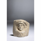 A LATE ROMAN LIMESTONE CORNER STONE WITH PORTRAIT.
3rd-4th century A.D.
H. 7,3 cm x L. 7 cm

Provenance
Swiss private collection of the Numismat ...
