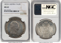 Franz II Taler 1823-A MS63 NGC, Vienna mint, KM2162, Dav-7. A handsome example with luxurious cartwheel luster and surfaces tinged with pastel amber t...