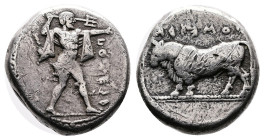 Lucania, Poseidonia. Circa 445-420 BC. Silver Nomos (18 mm, 8.11 g.). Poseidon, nude but for chlamys draped over both arms, holding trident aloft, adv...