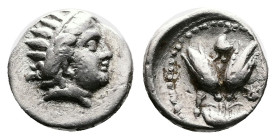 Islands of Caria, Rhodos, Rhodes, circa 275-250 BC. Silver Diobol (10.5 mm, 1.00 g.). Radiate head of Helios to right. Rev. P - O Two rose buds; above...