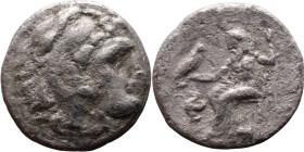 Alexander III (336-323 BC) Silver coin Obverse: Head of Herakles to right, wearing lion skin headdress Rev: Zeus seated left on low throne, holding lo...