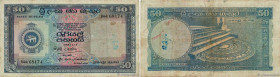 Country : CEYLON 
Face Value : 50 Rupees 
Date : 09 avril 1958 
Period/Province/Bank : Central Bank of Ceylon 
Catalogue reference : P.60a 
Alphabet -...