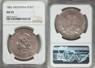 Republic Peso 1882 AU55 NGC, KM29. Random areas of rose, blue and gold toning. From Allen Moretti Swiss Collection

HID09801242017