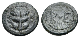 Italy, Bruttium, Rhegion, c. 450-425 BC. Æ Onkia (13mm, 1.43g). Lion mask facing. R/ R E; sprig of olive leaves between. HNItaly 2517; SNG ANS 679. VF...