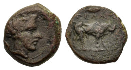 Sicily, Gela, c. 420-405 BC. Æ Onkia (10mm,1.4g). Bull advancing r. on exergual line; above, olive-leaf, in ex., one pellet, dotted border. R/Head of ...