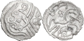 Celtic World. Celtic Gaul, Picardie. AR Quinarius, c. 50 BC. Type 'au sanglier'. Class I. Obv. Stylized, helmeted head of Athena right. Rev. Horse gal...