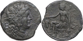 Greek Italy. Northern Apulia, Venusia. AE Nomos, c. 210-200 BC. Obv. Head of Dionysos right, wreathed with ivy; VE monogram behind. Rev. Dionysos seat...
