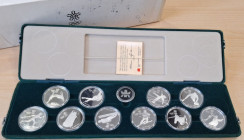 Canada. Elisabetta II. 1952-2022. Dollaro 1988. Calgary. Ag. Confezione da 10 monete. Peso 10 once di fino. Proof. In cofanetto della zecca. Scatolino...