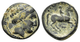 KINGS of MACEDON. Philip I The Arab.I.(359-336 BC).Uncertain in Macedon.Ae.

Obv : Male head right, wearing tainia.

Rev : ΦΙΛΙΠΠΟΥ.
Youth on horsebac...