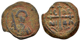 CRUSADERS.Antioch.Tancred.(1101-1112).Follis.

Obv : KE BOIΘH TANKRI.
Bust of Tancred facing, wearing turban and chain mail, holding sword over his sh...