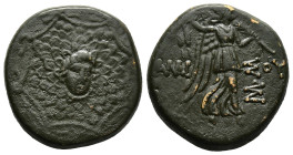 PONTOS.Amisos.(Circa 105-63 BC).Ae.

Obv : Aegis with Gorgon's head at center.

Rev : AΜΙΣΟΥ.
Nike advancing right, holding wreath and palm branch, be...