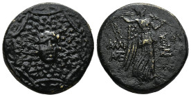 PONTOS.Amisos.(Circa 105-63 BC).Ae.

Obv : Aegis with Gorgon's head at center.

Rev : AΜΙΣΟΥ.
Nike advancing right, holding wreath and palm branch, be...